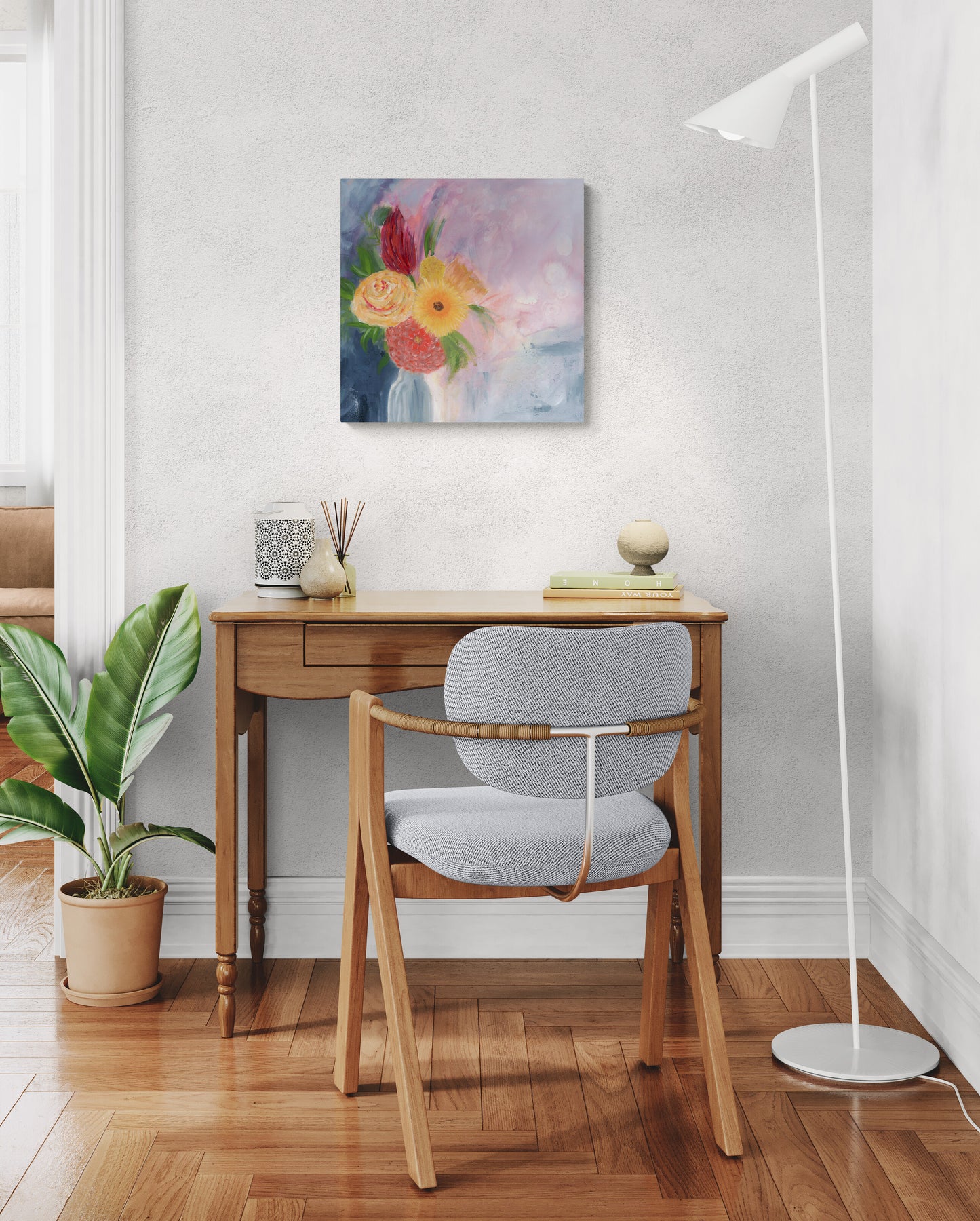 Original mixed media art in home office by Little Haven Art Studio depicting vibrant flowers in vase in red, pink, purple, blue, green, and yellow. By Amanda Craig.