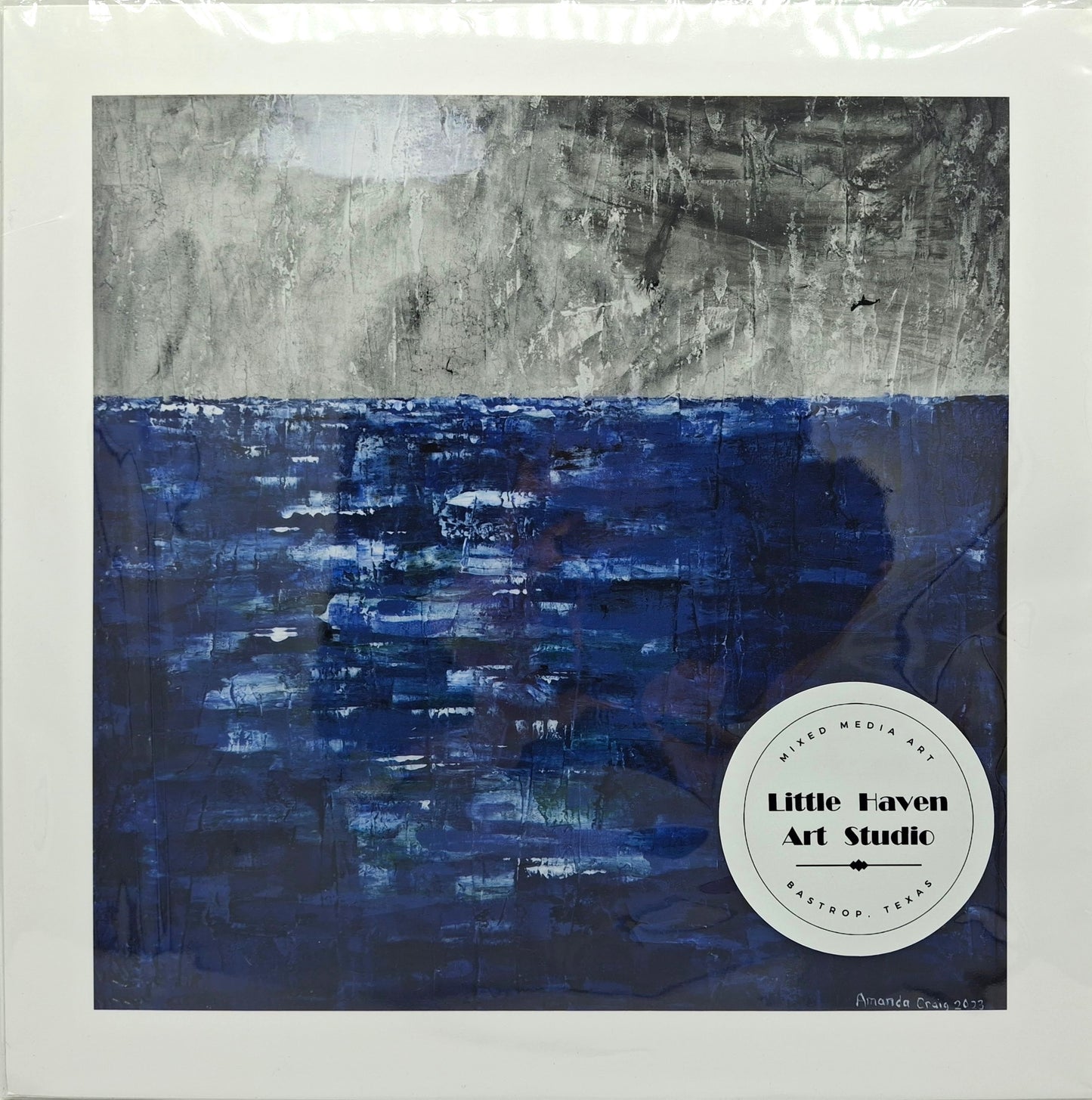 Print of abstract mixed media ocean wall art, titled "The Coming Storm," with blue and gray tones by Little Haven Art Studio.