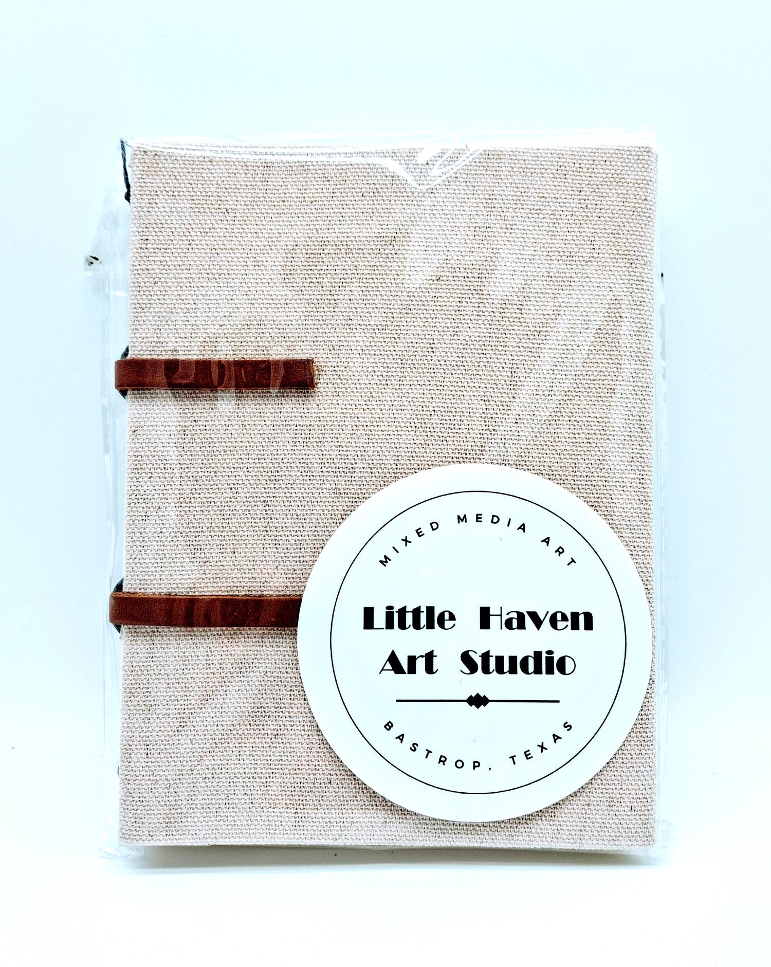 Handmade art journal 6" x 4.5" x 1" with brown canvas cover and gray thread made by Amanda Craig of Little Haven Art Studio.