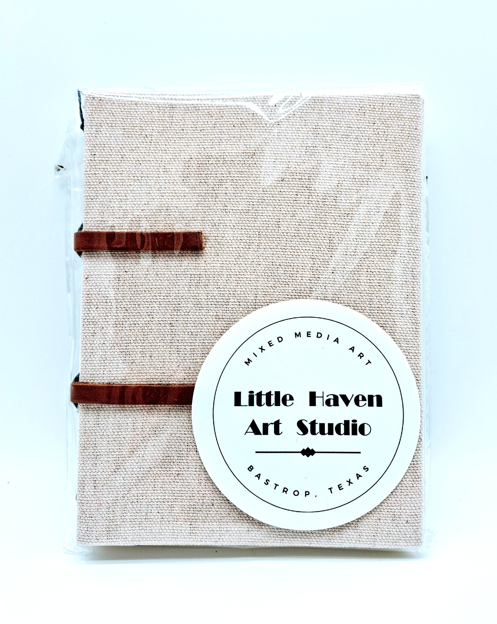 Handmade art journal 6" x 4.5" x 1" with brown canvas cover and gray thread made by Amanda Craig of Little Haven Art Studio.