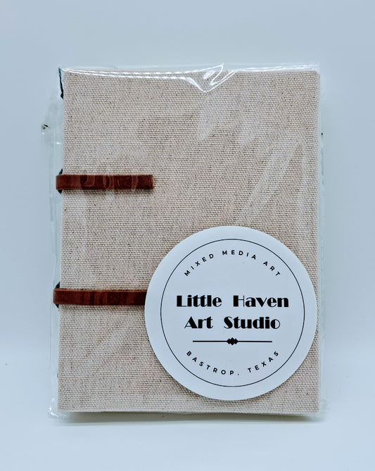 Handmade art journal 6" x 4.5" x 1" with brown canvas cover and gray thread made by Amanda Craig.