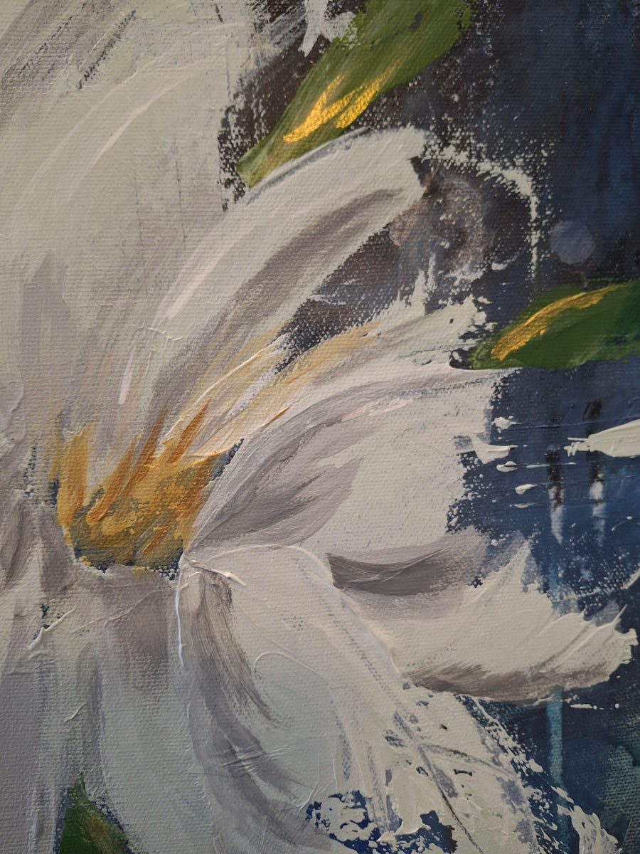 Close up image of white flower in sapphire blue background with gold details.