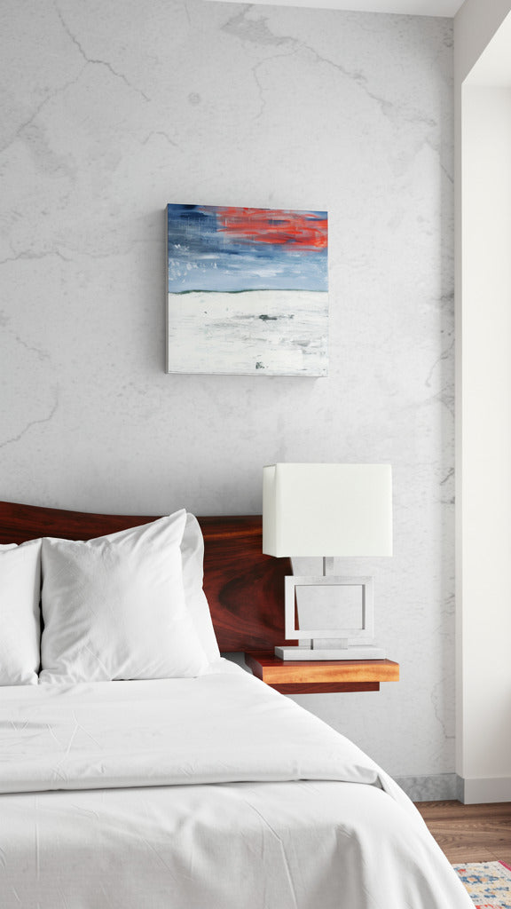 "New Beginnings" abstract original wall art landscape painting with red and blue elements by Little Haven Art Studio hanging in bedroom with natural light.