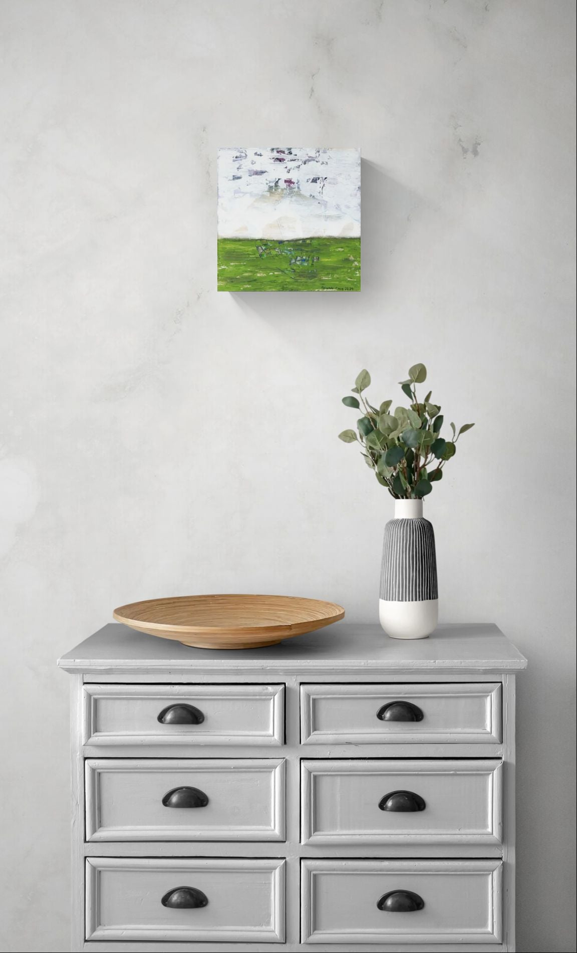 "Searching for Something" original abstract canvas wall art in green and white, by Amanda Craig of Little Haven Art Studio, hanging above gray vintage chest of drawers.