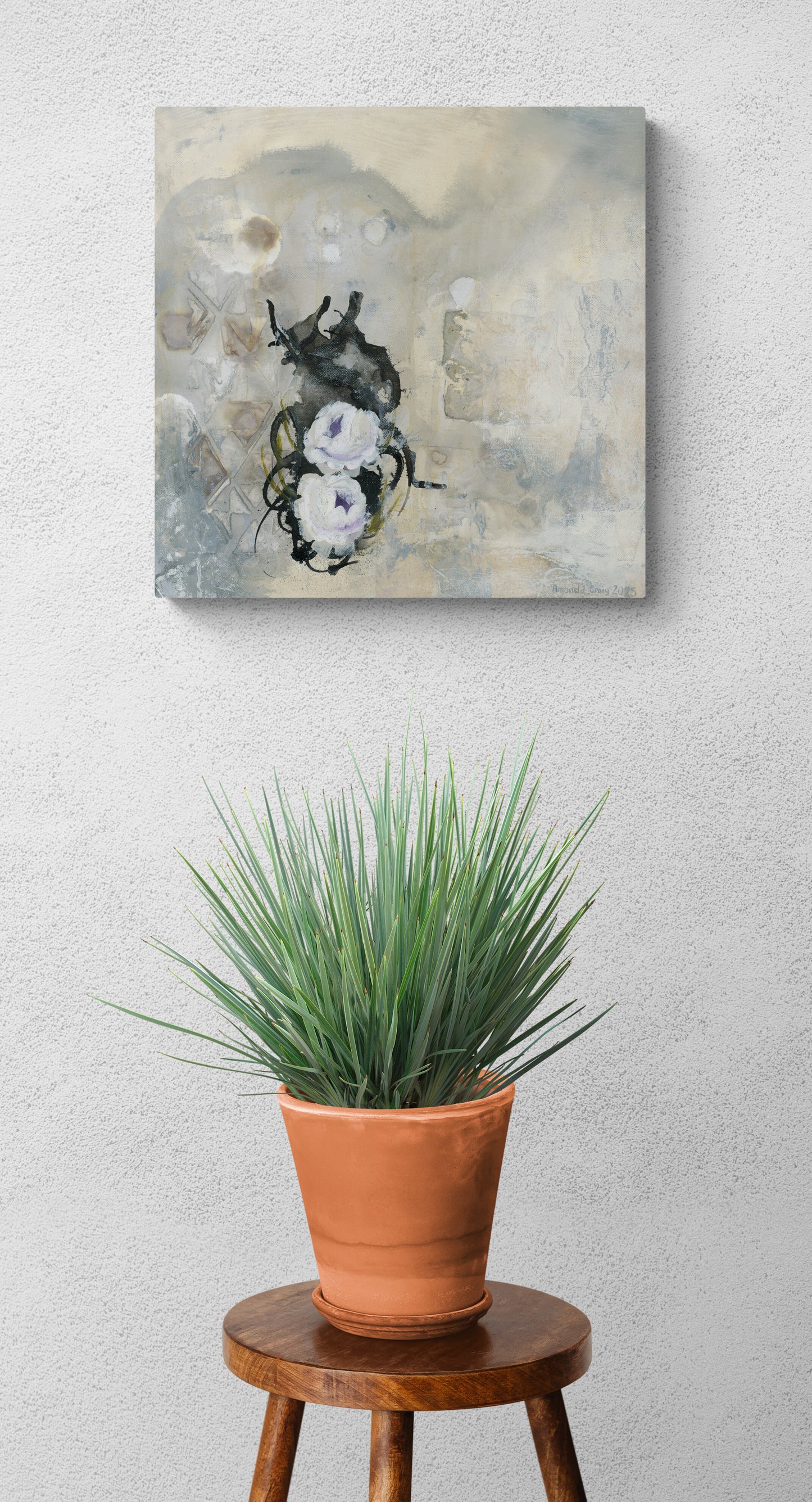 "Secret Garden" painting of a lavender and white roses with green leaves on a textured yellow, white, grey, and black background in a room above a plant by Amanda Craig.