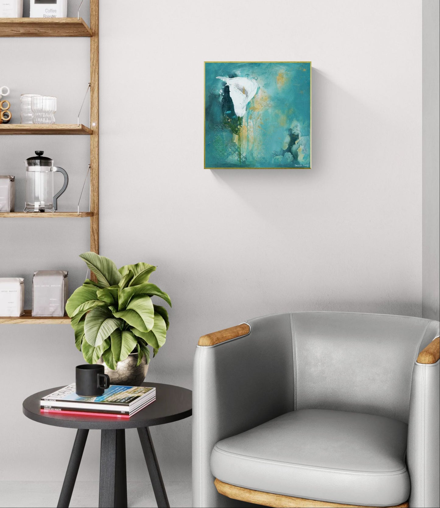 Original floral mixed media painting on abstract background titled, "Steadfast," by Amanda Craig of Little Haven Art Studio, in teal, white, green, and metallic gold, with gold tone floating frame hanging in living room above modern chair in silver, and next to side table with plant.
