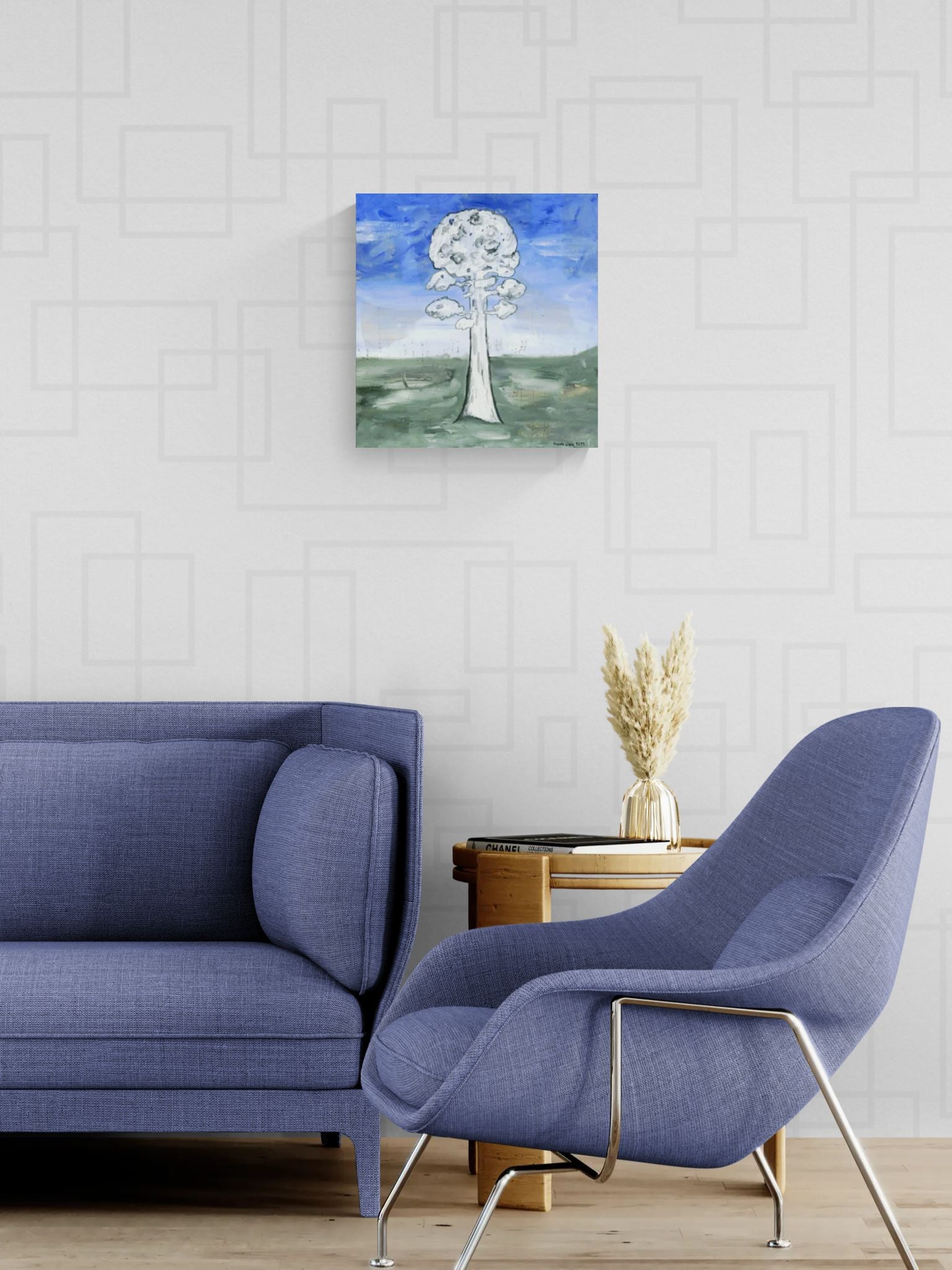 Original mixed media wall, titled "Struggling for Space" by Little Haven Art Studio, of an ashy tree with a backdrop of blue sky and green grass in retro living room with blue furniture.