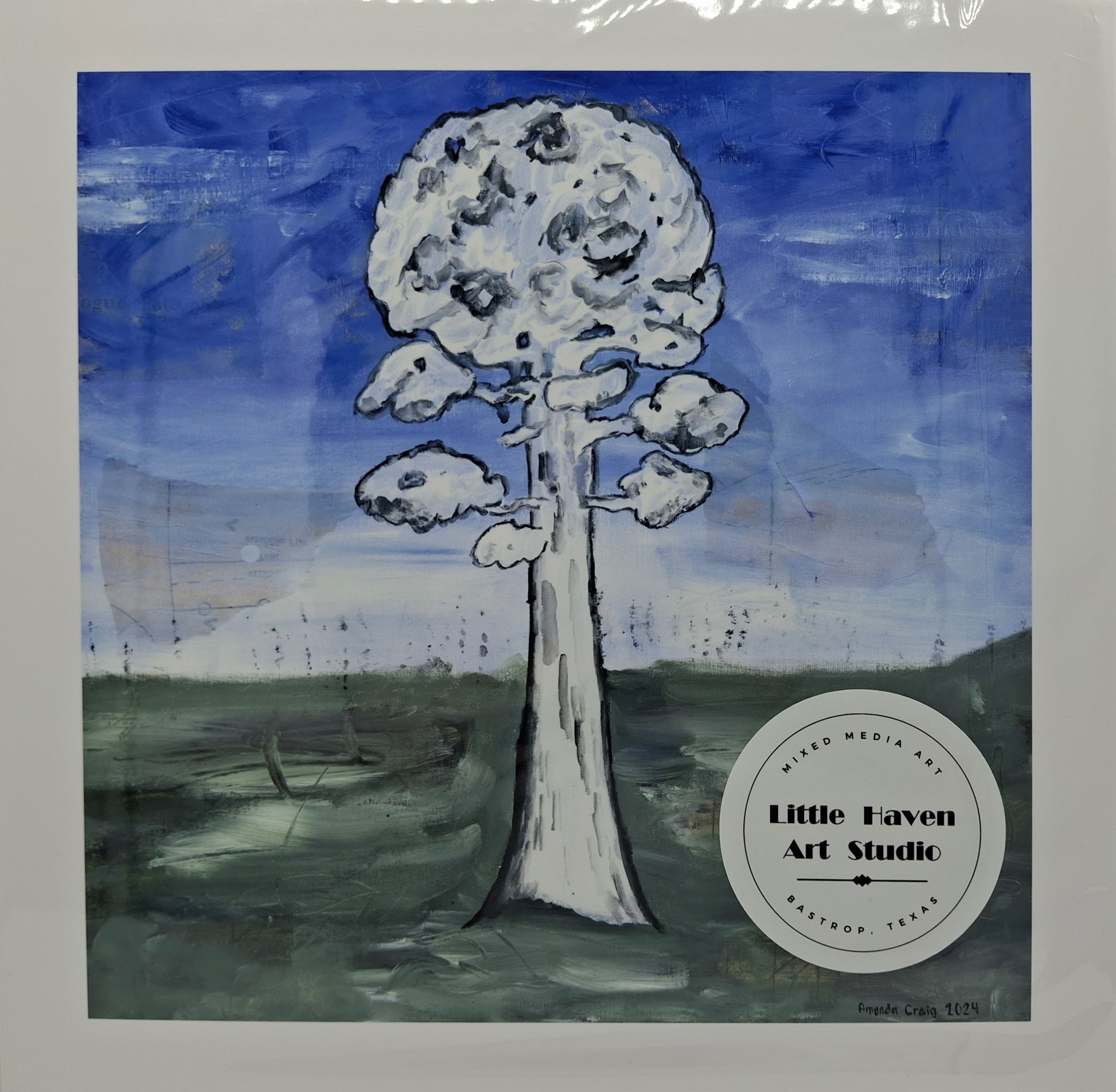 Print of mixed media art by Little Haven Art Studio of tree with blue sky and green grass. 